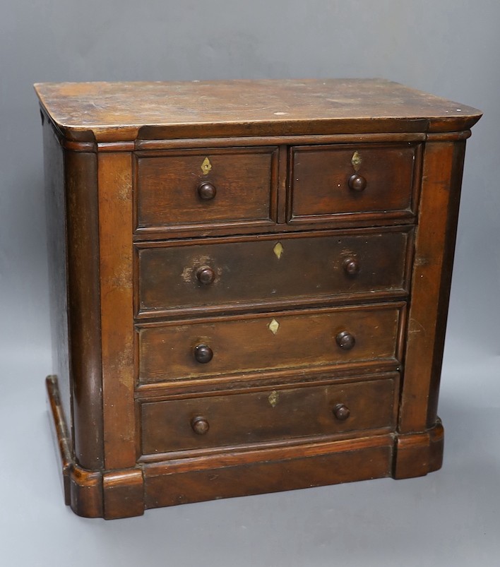 Two Victorian mahogany table top miniature chests of drawers, largest 39 cms wide x 38 cms high.